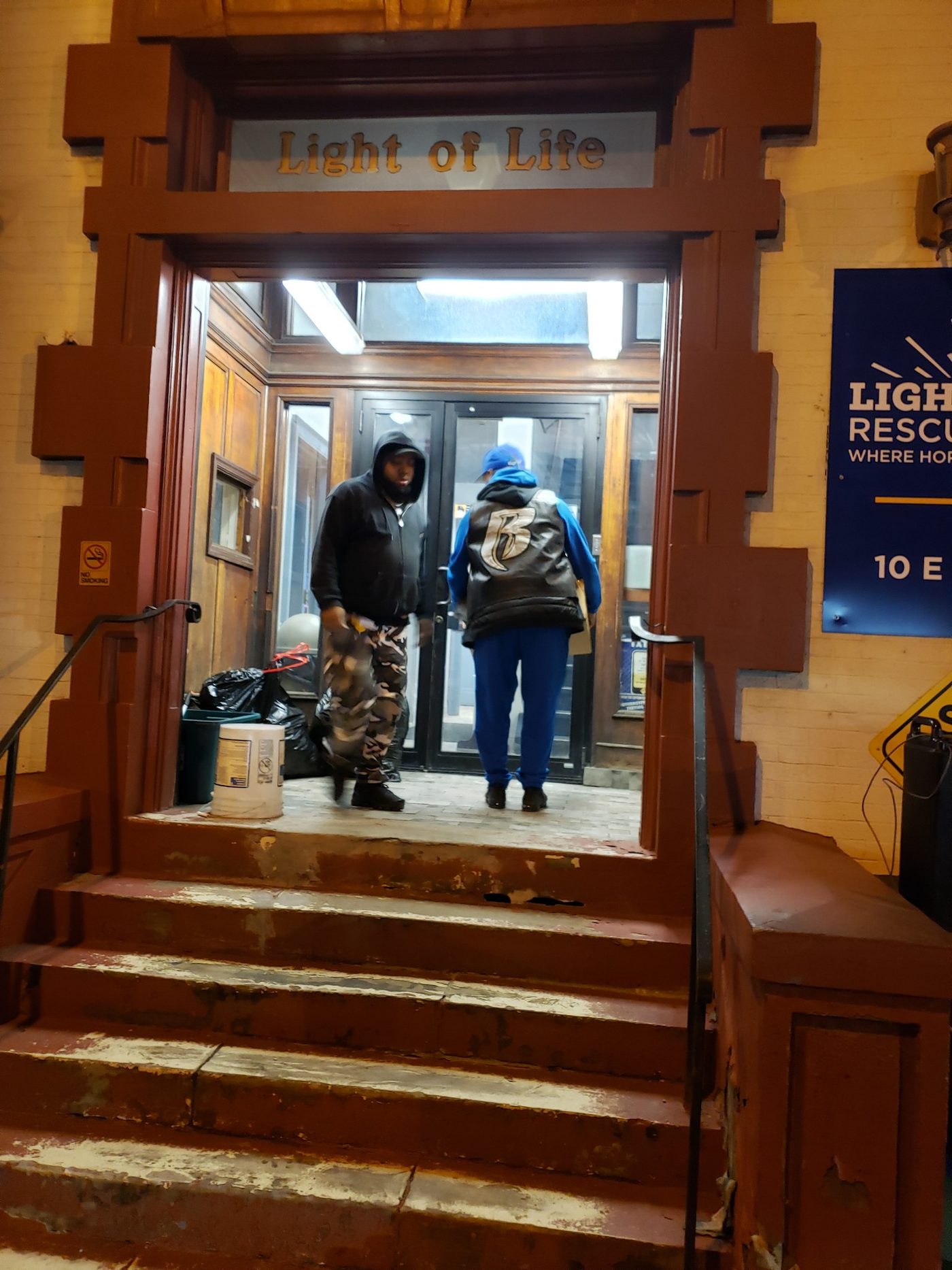 Volunteers carrying donations into Light of Life Rescue Mission